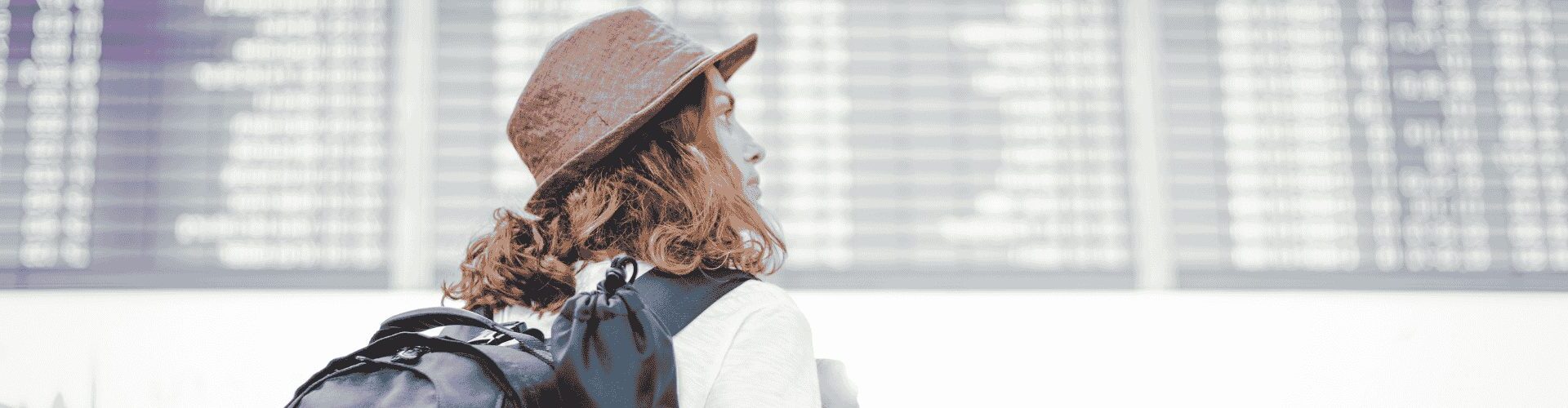 girl looking at airport flights